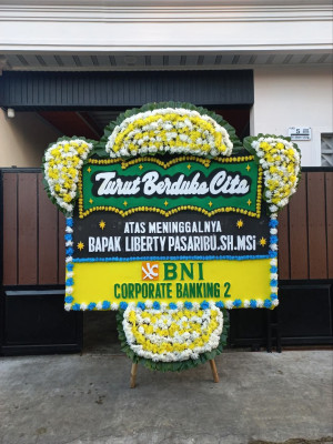 Papan Bunga Duka di Modelomo