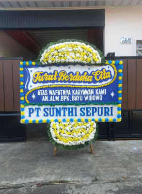 Papan Bunga Duka di Modelomo