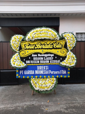 Papan Bunga Duka di Modelomo