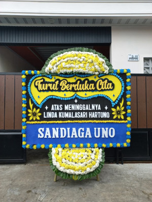 Papan Bunga Duka di Modelomo