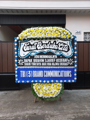 Papan Bunga Duka di Modelomo